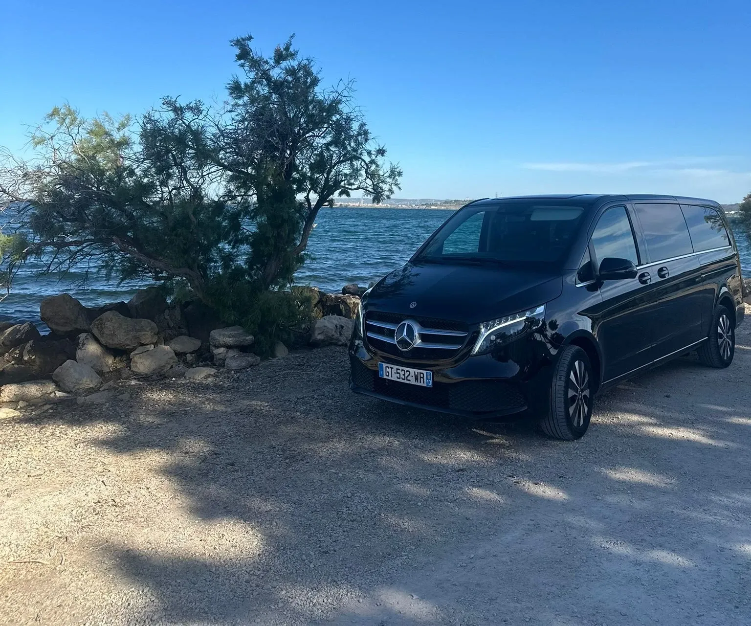 Massilia Services VTC Tesla Model Y at sunset by the sea in Marseille